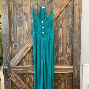 Cropped green jumpsuit with buttons